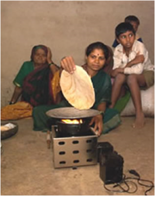 Village Woman Using Agni Biomass Stove