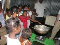 Haitian Girls at Viva Rio's Orphanage in Carrefour Sample a Traditional Meal Prepared on the CleanCook Stove