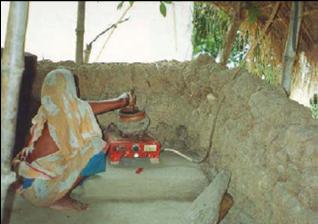 Woman Cooking With Biogas Woman Cooking With Biogas